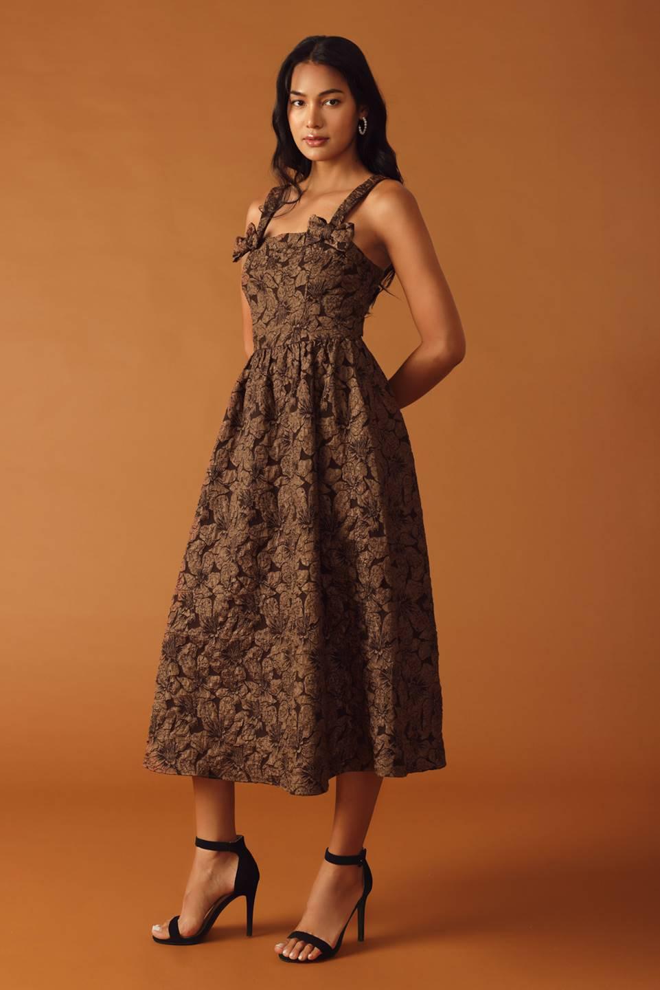 Full view of brown woven midi dress with floral design