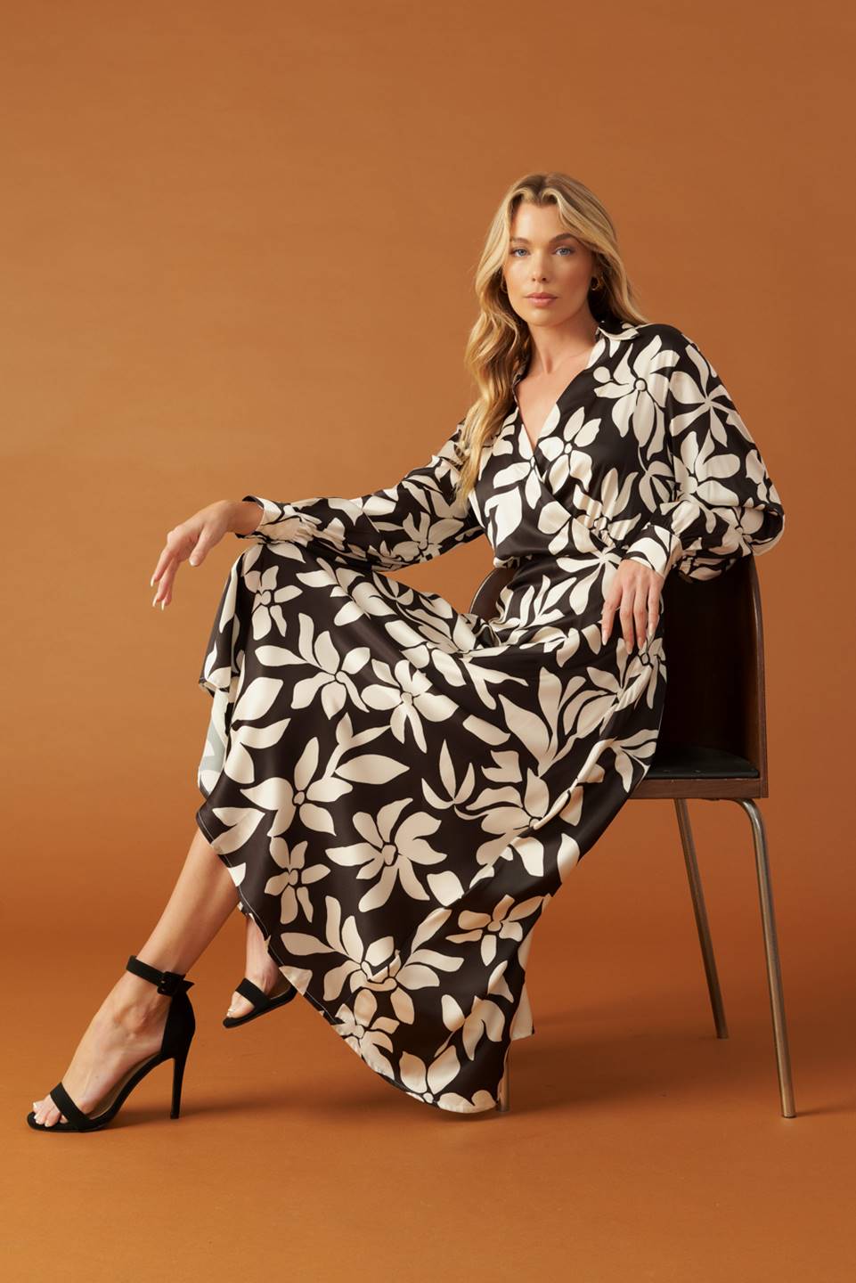 Black and white floral woven midi dress, seated pose