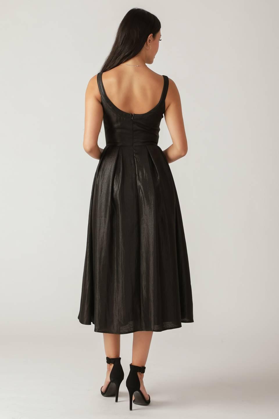 Back view of black woven midi dress with pleated skirt