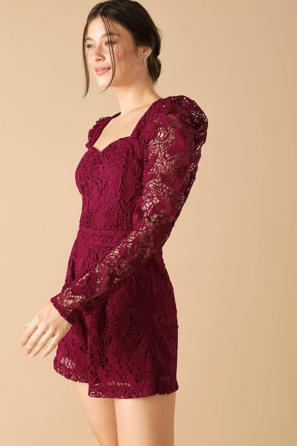 Side view of burgundy lace woven romper with puff sleeves.