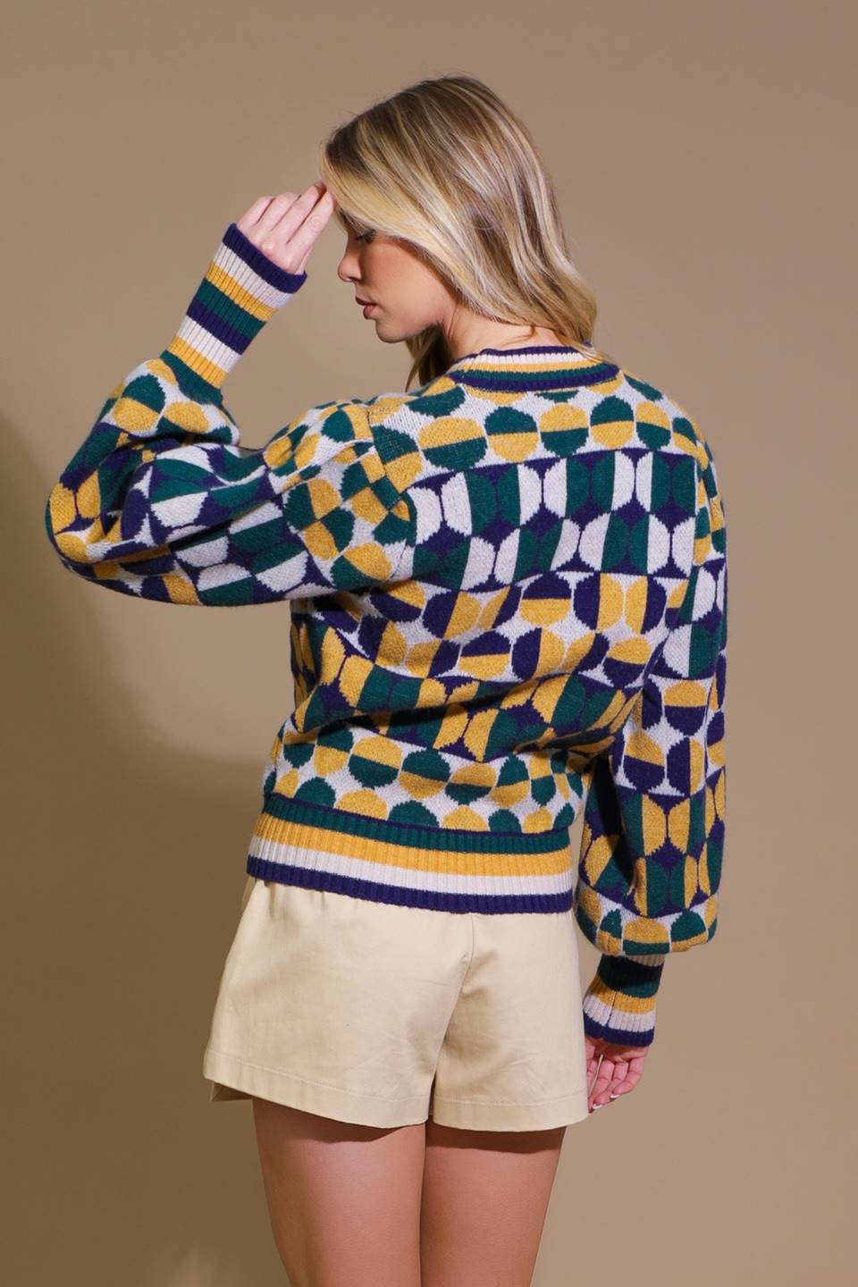 Back view of geometric jacquard sweater in vibrant colors