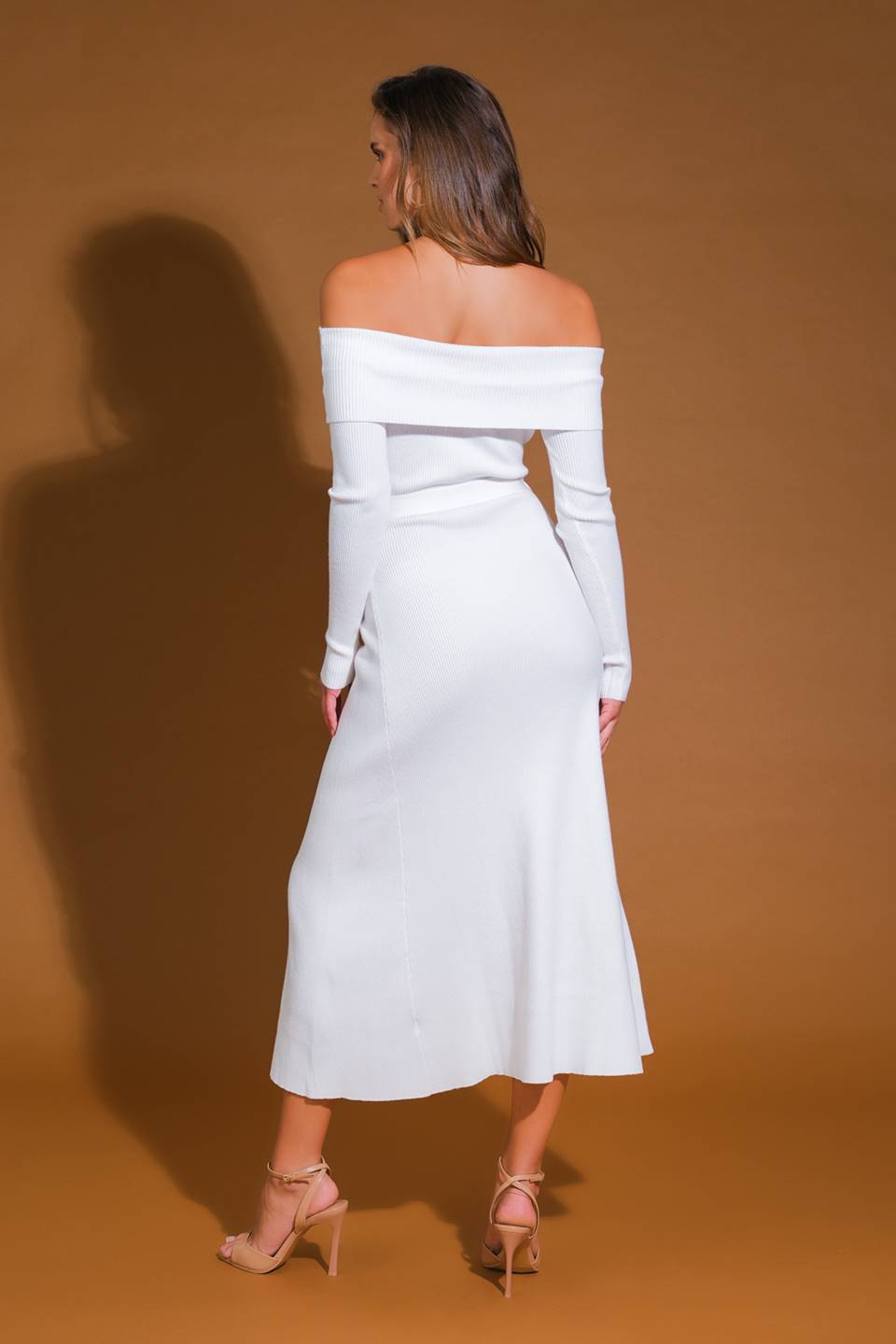 Back view of ivory off-shoulder sweater midi dress