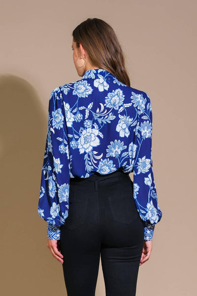 Navy floral woven top with long sleeves, back view