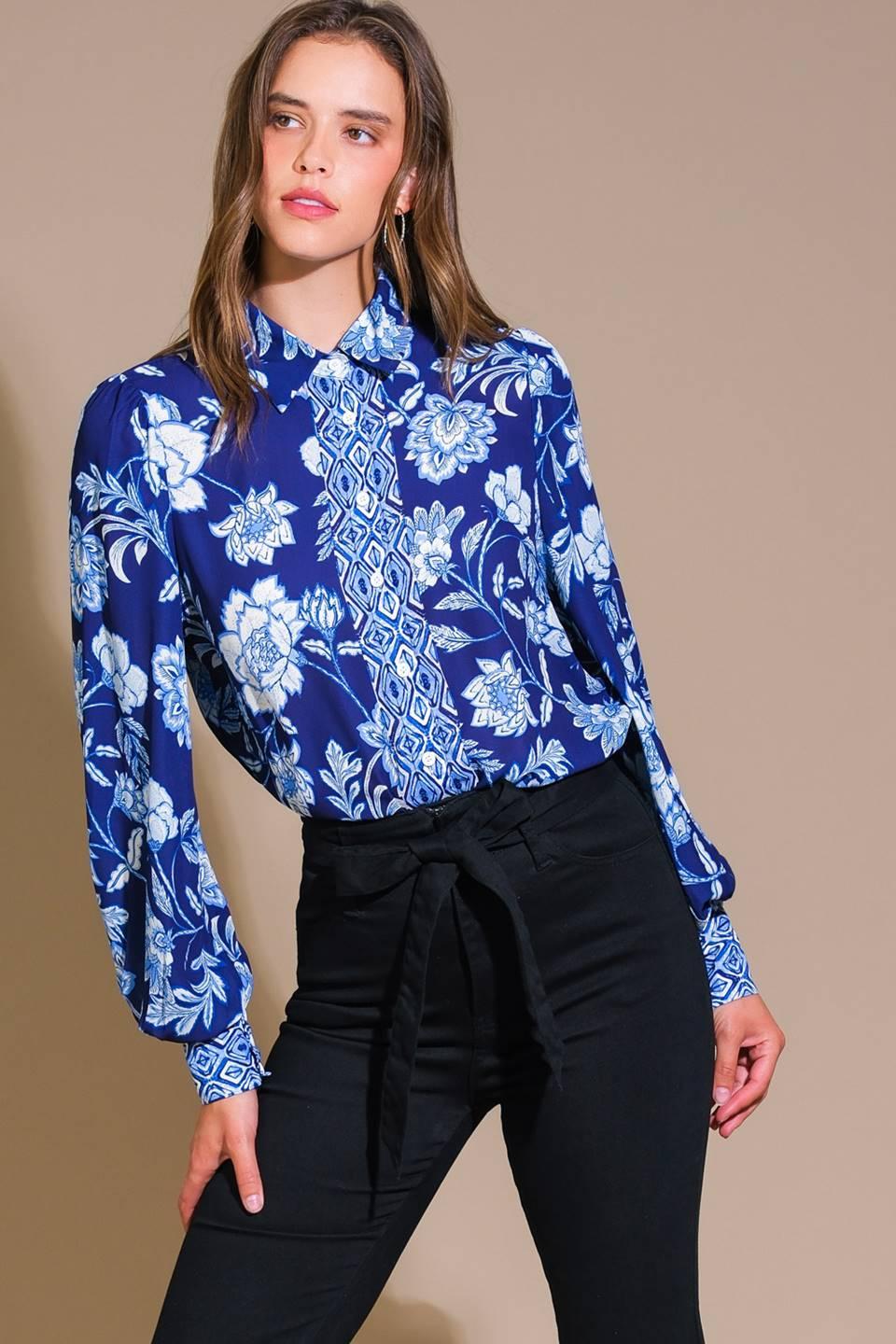 Navy floral woven top with long sleeves, close-up front view