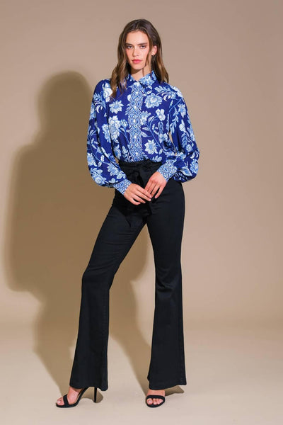 Navy floral woven top with black pants, full front view