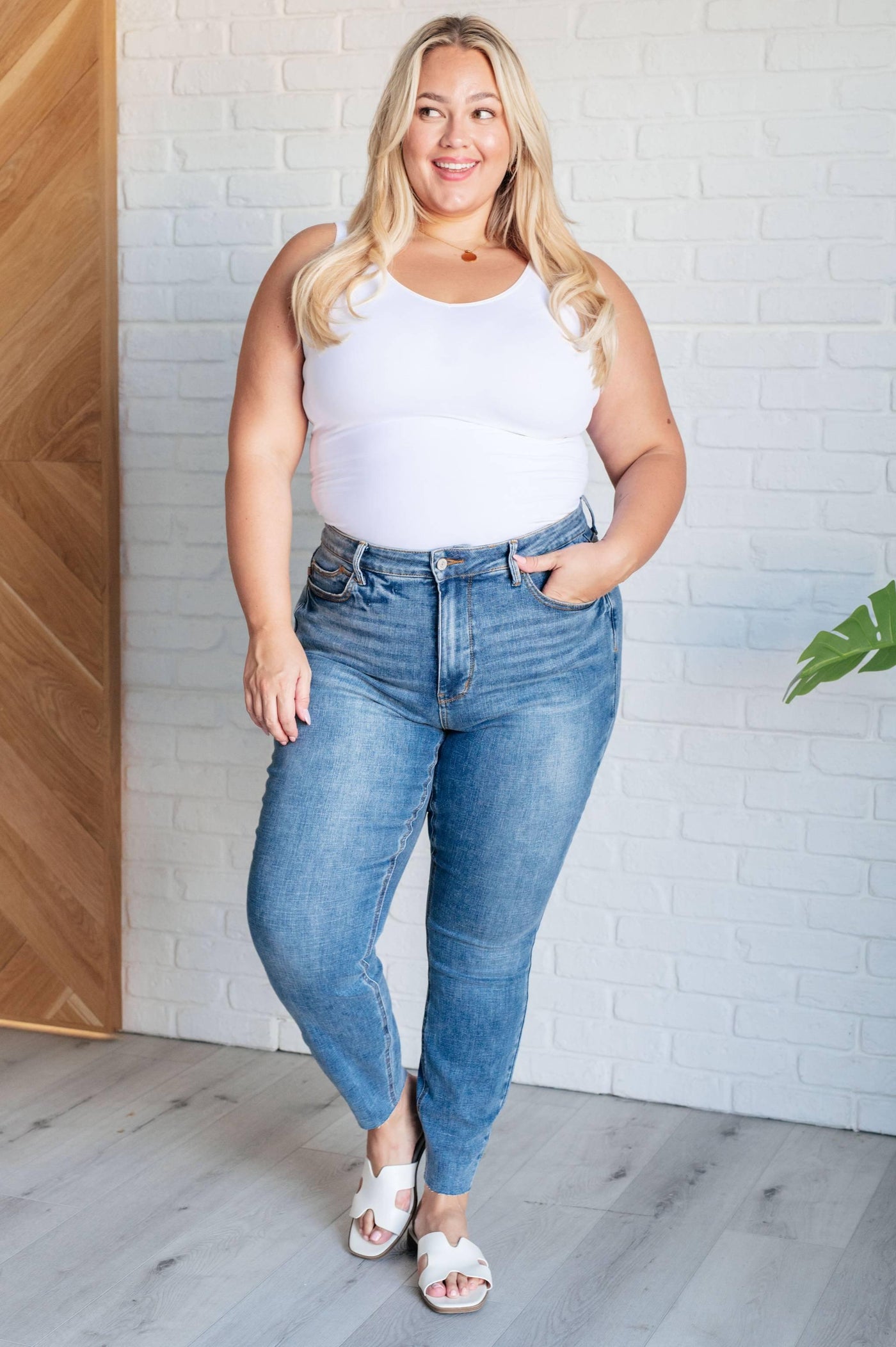 Curvy model posing in Nicole Tummy Control Skinny Jeans