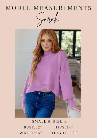 Model Sarah in purple sweater with measurements