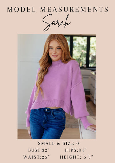 Model Sarah's measurements in purple sweater and jeans.