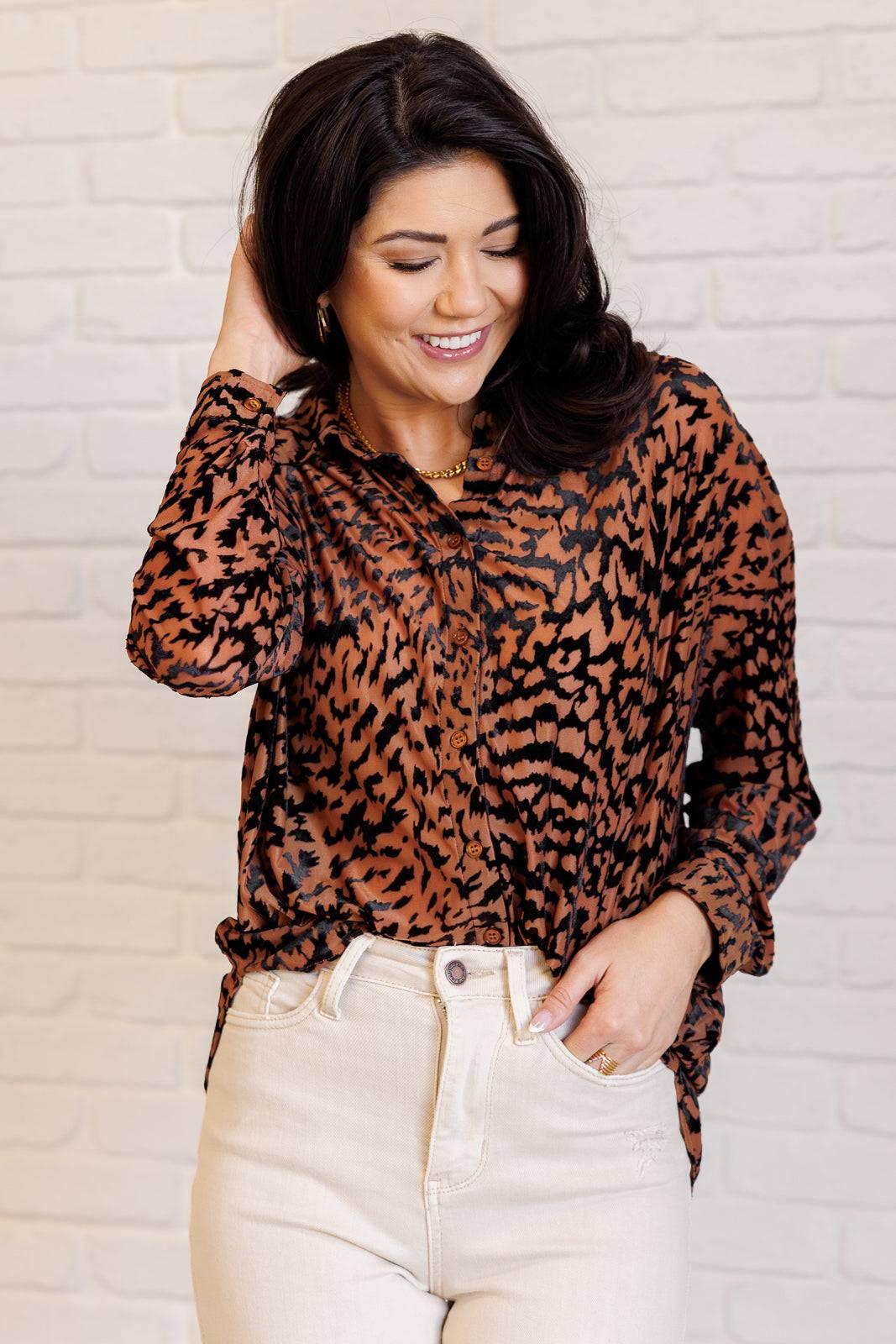 Close-up of Animal Print Blouse with white jeans