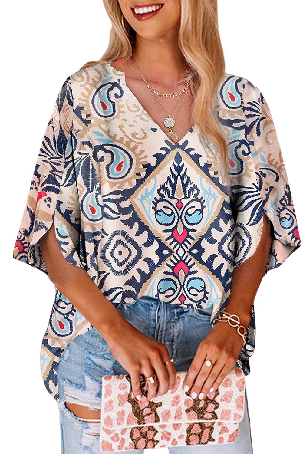 White abstract printed V neck blouse, styled with jeans