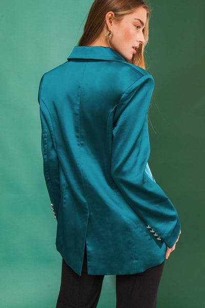 Back view of teal blazer with jewel button details