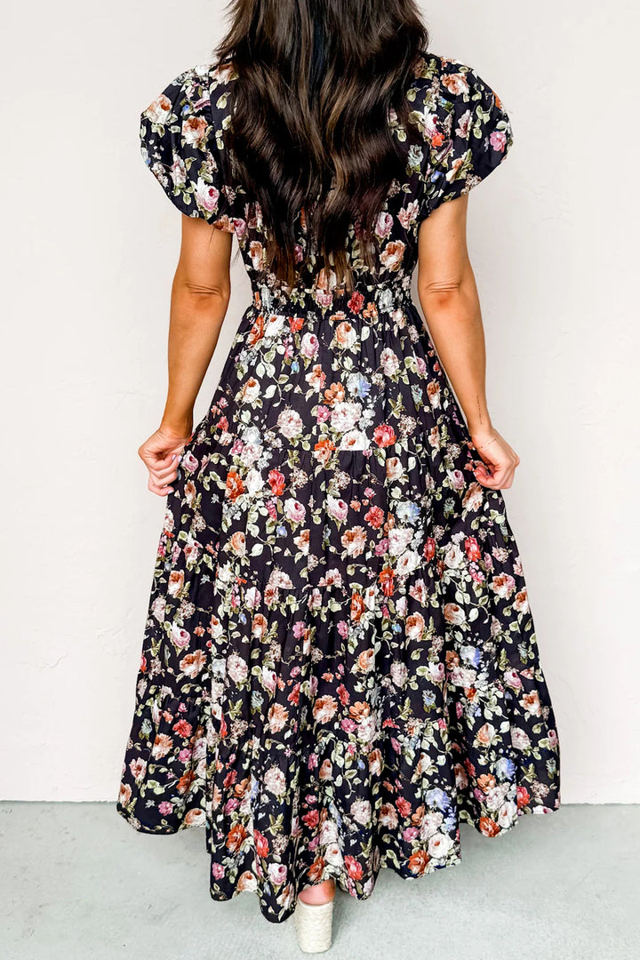 Woman wearing a floral dress with a plain background