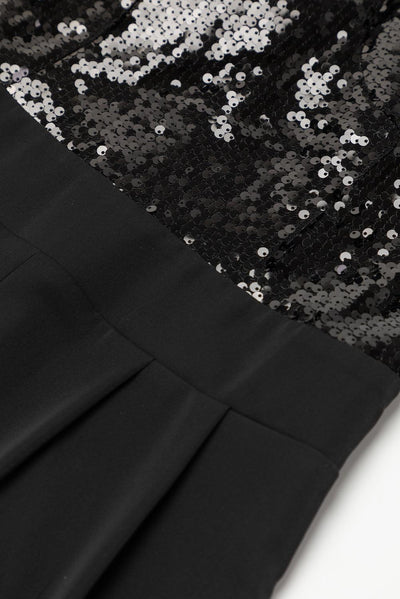 Sequin and fabric detail on black jumpsuit