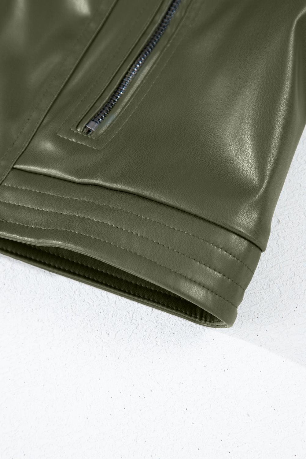 Close-up of sage green jacket zipper detail