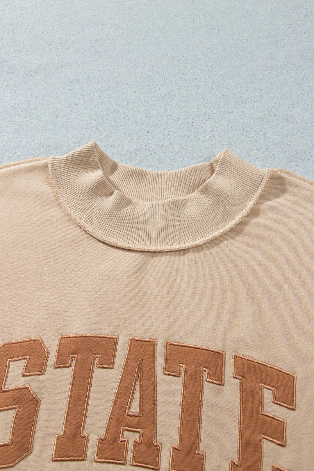 Coffee Exposed Seam Mock Neck STATE Letter Graphic Loose Sweatshirt
