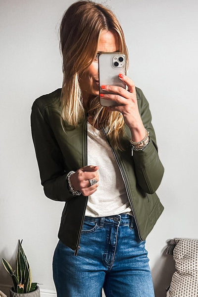 Sage green bomber jacket styled with jeans