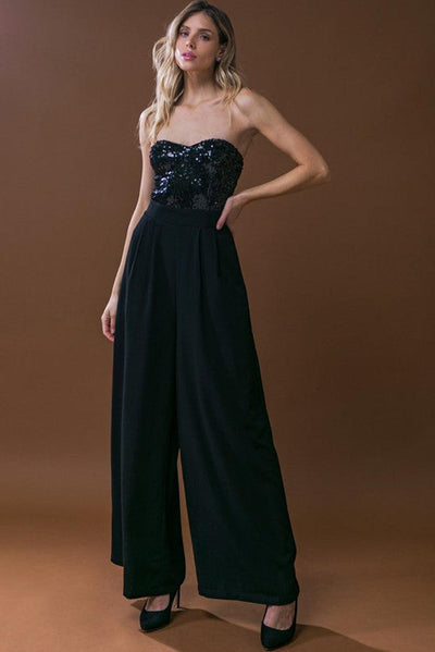 Stylish black sequin tube top jumpsuit on model