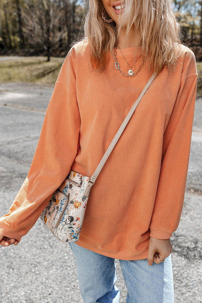 Orange oversized sweatshirt with ribbed texture