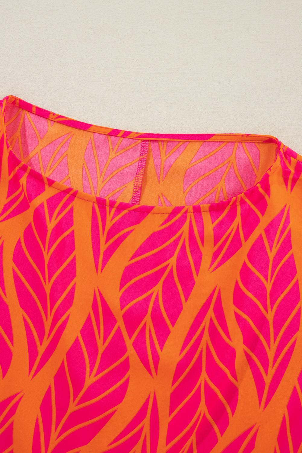 Detailed view of neckline on tropical leaf print blouse