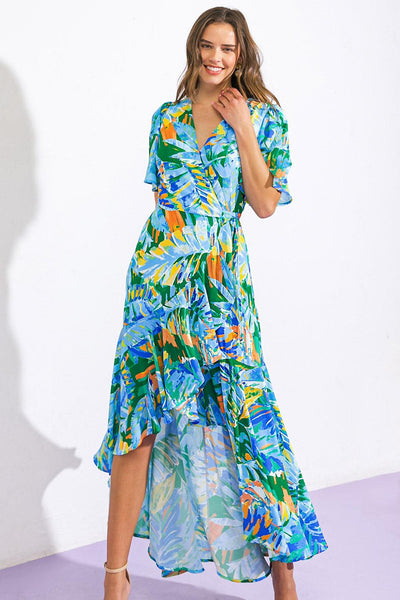 Model in blue-green woven hi-lo dress, abstract print