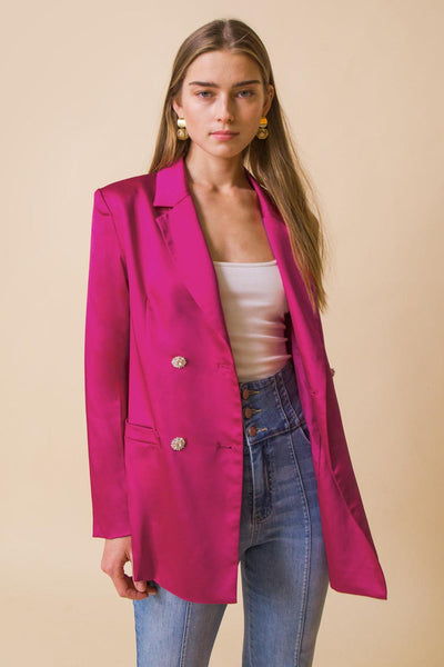 Pink blazer with jewel buttons and white top