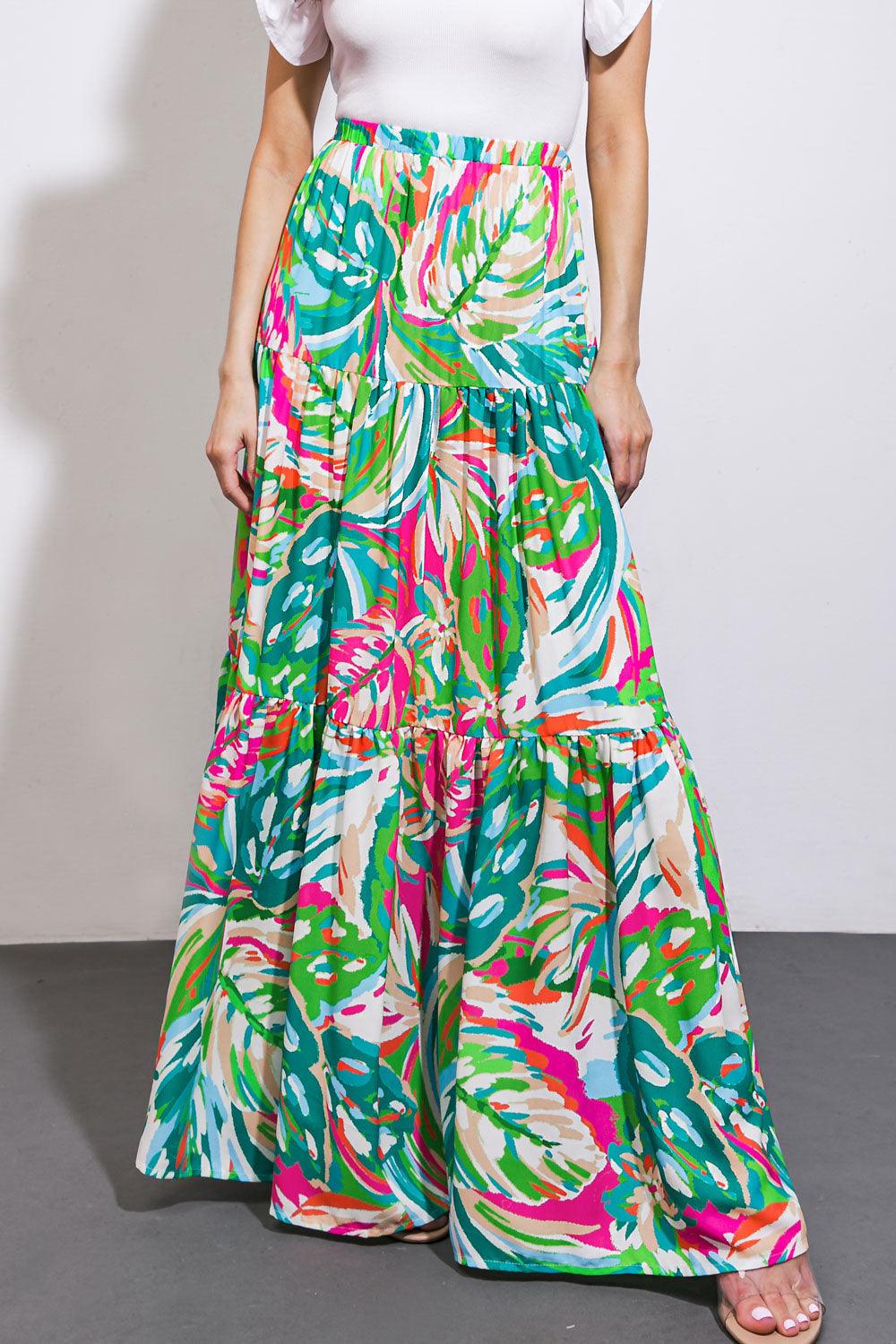 Front view of green and pink patterned woven maxi skirt.