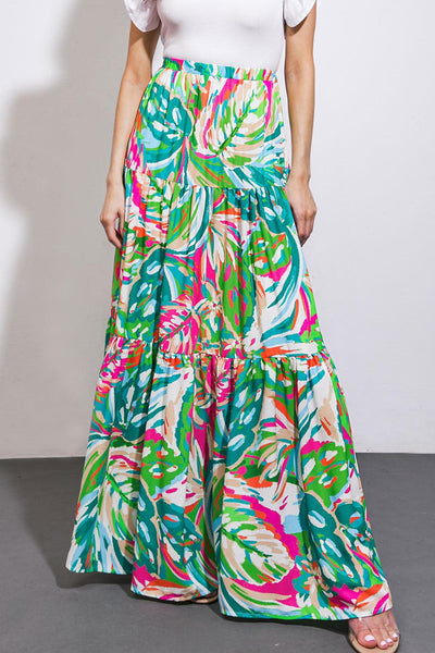 Front view of green and pink patterned woven maxi skirt.