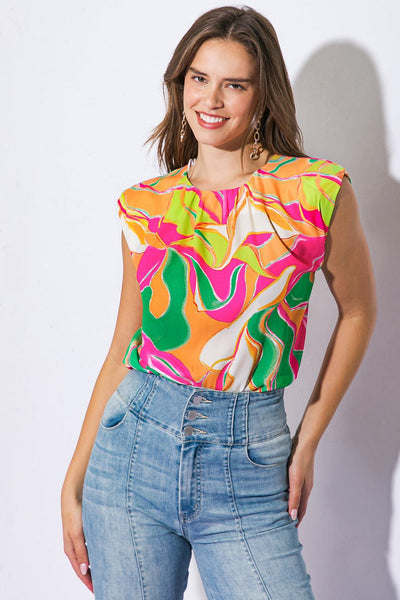 Model wearing vibrant woven top with abstract design