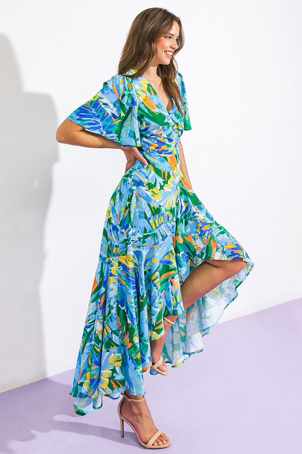 Side view of vibrant woven hi-lo dress with abstract pattern