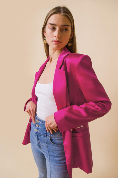 Pink blazer with white top and jeans